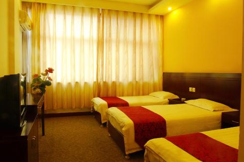 Huangshan Tangkou Haoshi International Youth Hostelにあるベッド