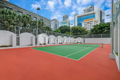 a tennis court in front of a city at Camila by Kozystay - Kuningan in Jakarta