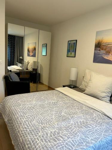 a bedroom with a large bed and a desk at Daianas Corner in Elgg