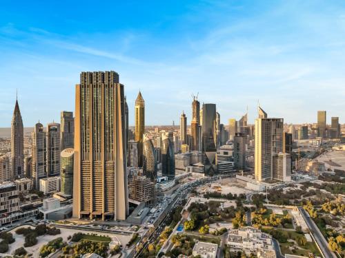 an aerial view of a city with tall buildings at Royal Vista at Downtown Views II - Downtown Dubai City Views - Brand New Luxury 2BR Apartment in Dubai