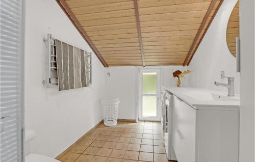 a kitchen with white walls and a wooden ceiling at 3 Bedroom Lovely Home In Jerup in Jerup