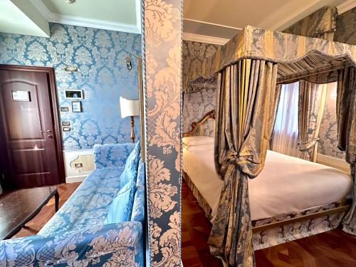 a bedroom with two bunk beds with blue wallpaper at Canal Grande in Venice