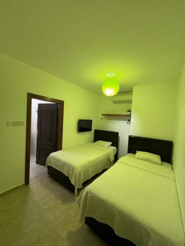 Ένα ή περισσότερα κρεβάτια σε δωμάτιο στο Betul Guest House