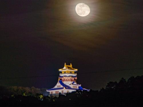 a large building with a moon in the sky at Guest House Isehutami - Vacation STAY 89326v in Ise