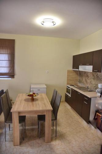 a kitchen with a table and chairs in a room at Elegant Home in Árgos Orestikón