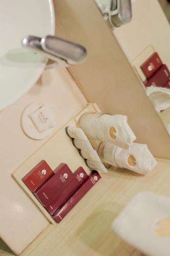 a close up of a counter with towels on a table at Bravura Gold Resort in Meerut