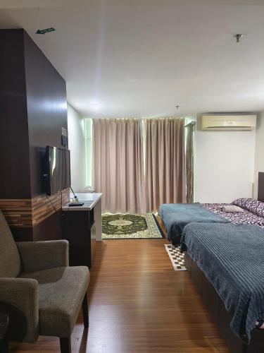 Ένα ή περισσότερα κρεβάτια σε δωμάτιο στο AZH Studio KBCP Bandar Kota Bharu