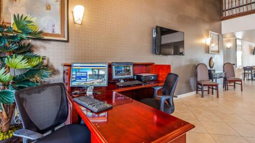 an office with two computer monitors on a desk at Best Western Plus Main Street Inn in Brawley