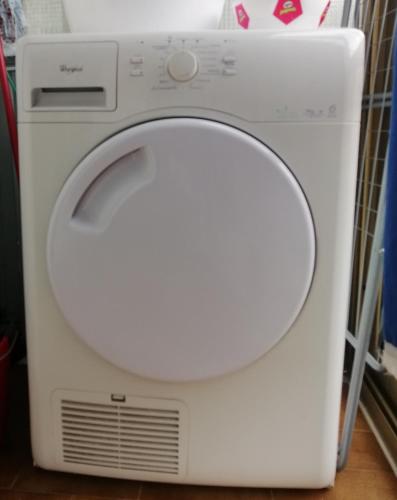a white washing machine sitting on the floor at Ronf & Gnam GALIMBERTI in Turin