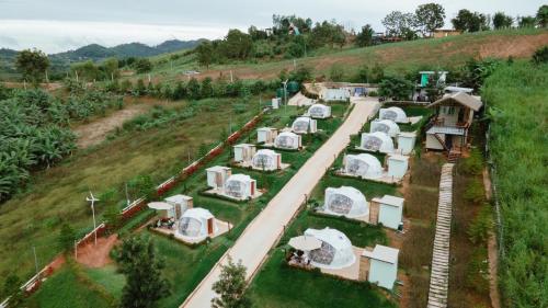 an aerial view of a group of tents in a field at Florafreskhaokho in Khao Kho