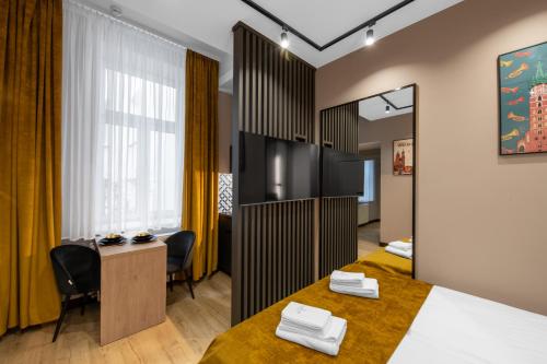 TV a/nebo společenská místnost v ubytování Platinia Premium Apartments