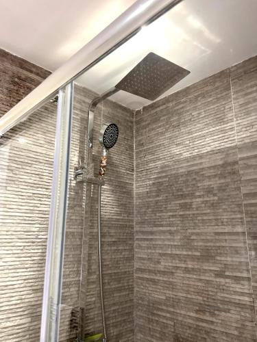 a bathroom with a shower with a glass door at Modern 2 Bedroom Apartment in Leicester City Centre with Free WiFi in Leicester