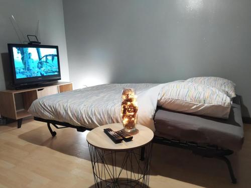 Ένα ή περισσότερα κρεβάτια σε δωμάτιο στο Chambre Cocon Proche RER aux Portes de Paris
