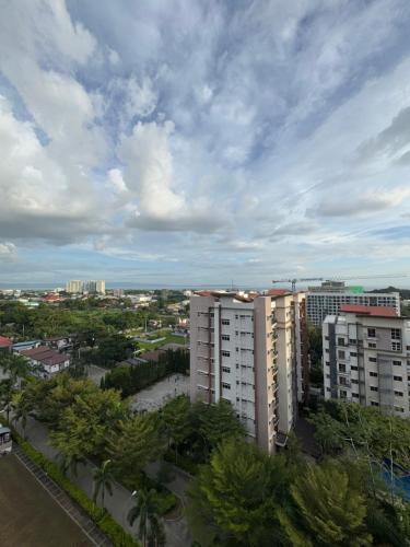 a view of a city with palm trees and buildings at Asters - Two Bedroom Condo Unit with Balcony in Davao City