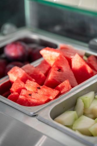 two trays of fruit with apples and watermelon at La Luna Hotel in Troulos
