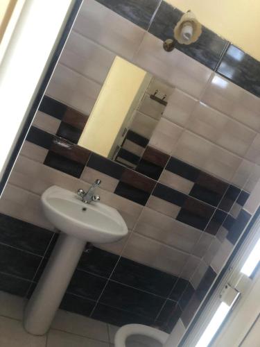 Ένα μπάνιο στο Saint Rita Guest House Alex