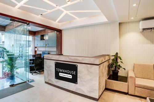 a lobby with a tokyo house sign on a counter at Super Townhouse HSR Layout Formerly Seven Olives in Bengaluru
