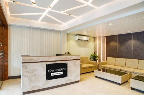 a lobby with a couch and a waiting room at Super Townhouse HSR Layout Formerly Seven Olives in Bengaluru