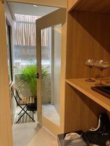 a door with a mirror in a room with a plant at Urban room samed in Ko Samed