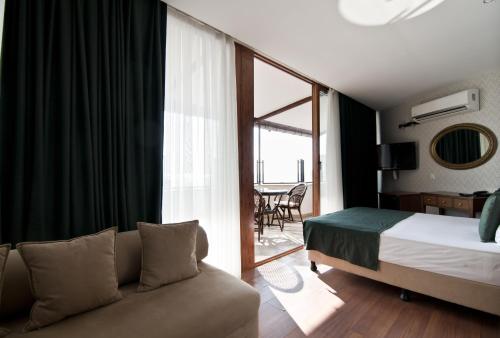Postel nebo postele na pokoji v ubytování Artefes Hotel Old City