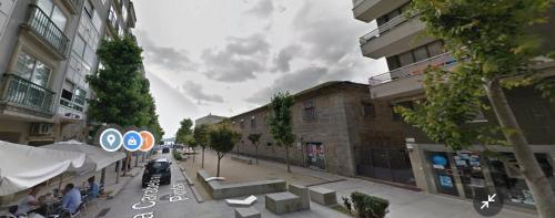 a rendering of a city street with buildings at Piso en el corazón de Baiona con vistas al mar in Baiona