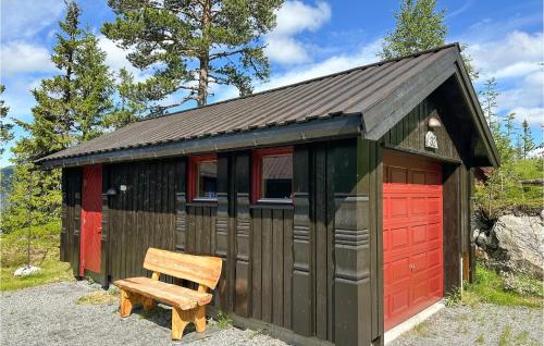 a smallshed with a bench in front of it at Stunning Home In Rjukan With Wifi in Rjukan