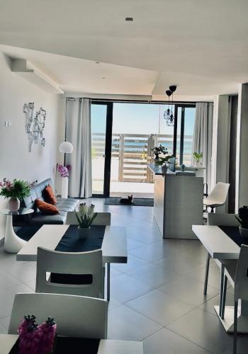 a living room with a view of the ocean at CARFAGNINI ROOMS in Termoli