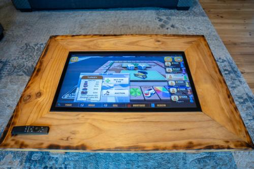an ipad in a wooden box on the floor at Funday Farm Adelaide Hills in Norton Summit