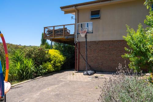 a basketball hoop on the side of a house at Funday Farm Adelaide Hills in Norton Summit