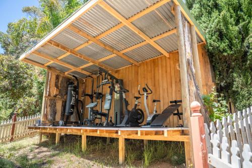 a wooden shed with exercise equipment in it at Funday Farm Adelaide Hills in Norton Summit
