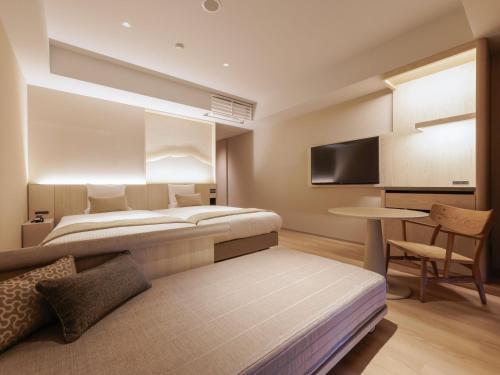 Ένα ή περισσότερα κρεβάτια σε δωμάτιο στο Kamenoi Hotel Tsukubasan