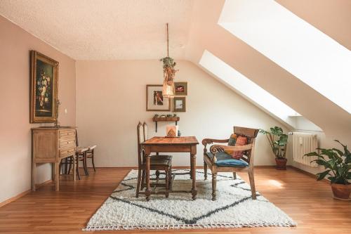 a dining room with a table and chairs at Sam & Karo Boutique Apartment in Trier