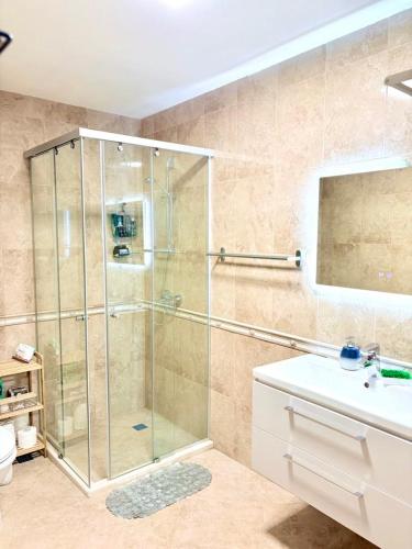 a bathroom with a shower and a sink at Apartments Sea Sunrise, complex Carpe Diem, FREE PARKING in Balchik