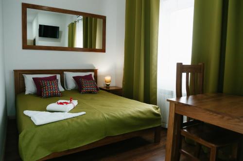 Кровать или кровати в номере Отель Александрия Прилуки