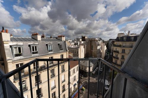 a view of a city from a balcony at ELSA, Hôtel Paris in Paris