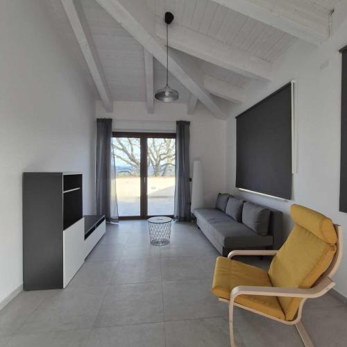a living room with a couch and a tv at Agriturismo Giorgini in Marsciano