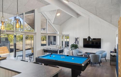 a living room with a pool table and a tv at Gorgeous Home In Højby With Kitchen in Højby