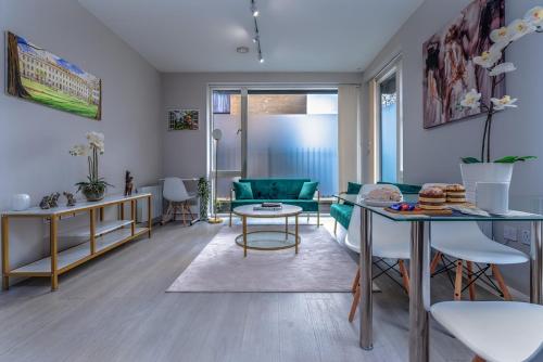a living room with a couch and a table at Garden View Serviced Flat by Castle Park, Lift in Bristol