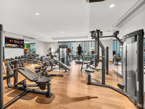 a gym with treadmills and cardio equipment in a building at The Chic Downtown Suite Luxury near Burj Khalifa in Dubai