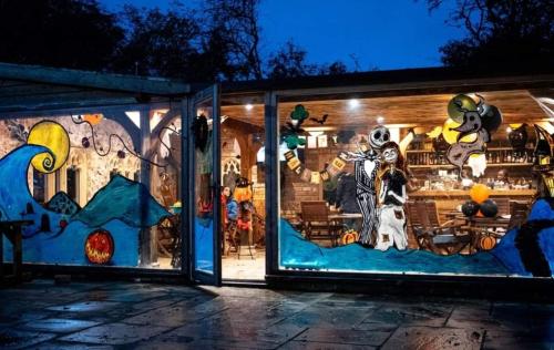 a store front with a painting on the window at Burtree Country House, Tipi's, Treehouse & Lodge & house rooms with hot tubs in a private garden in Thirsk
