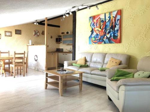 a living room with a couch and a table at Ferien auf dem Bauernhof Nr. 101 in Altenhagen
