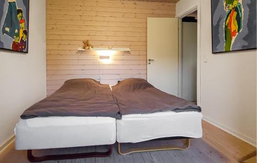 a bedroom with a bed in a room with a door at Amazing Home In Augustenborg With Wifi in Augustenborg