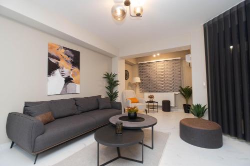 a living room with a couch and a table at Urban Living in Gevgelija