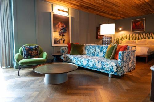 a living room with a couch and a bed at The Dean Galway in Galway