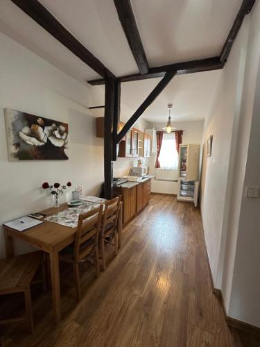 a kitchen and dining room with a table and chairs at Penzion 4 Dvory in České Budějovice