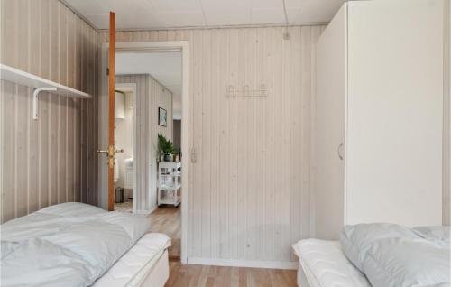 two beds in a bedroom with white walls at Gorgeous Home In Farsø With Wifi in Farsø