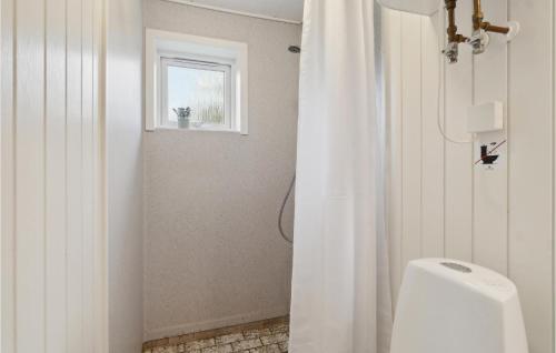 a bathroom with a white shower curtain and a window at Gorgeous Home In Farsø With Wifi in Farsø