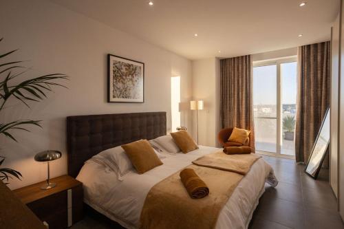 Ένα ή περισσότερα κρεβάτια σε δωμάτιο στο The View Penthouse