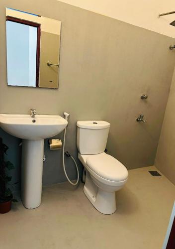 a bathroom with a toilet and a sink at Sera 86 Airport Transit Stay in Katunayake