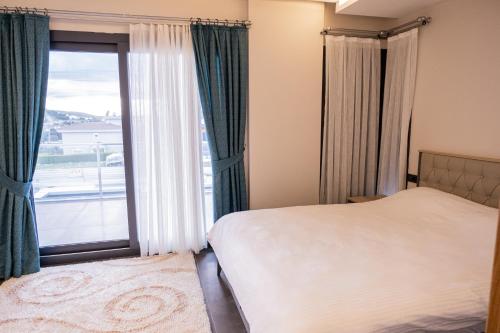 Postel nebo postele na pokoji v ubytování Süper villa havuzlu